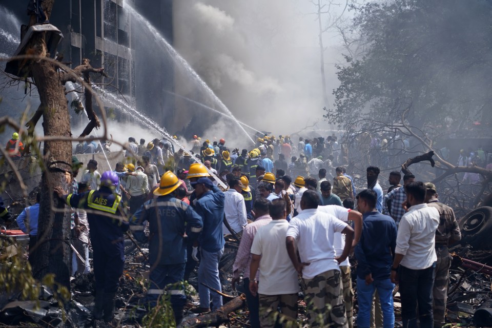 Firefighters extinguishing a plane crash.