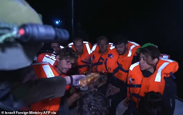 After diverting the boat to the port of Ashdod, Israel's foreign ministry posted a picture of the activists all in orange life jackets being offered water and sandwiches (pictured)