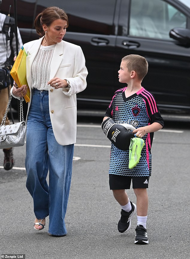Coleen looked every-inch the glamorous mum as she stepped out in high-waisted jeans, a white knit jumper and tailored cream blazer
