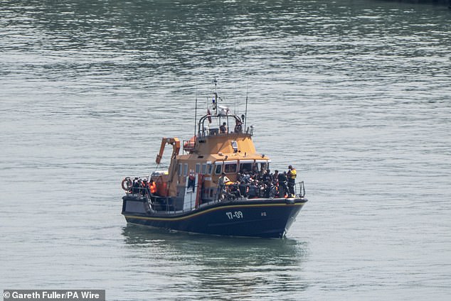 His comments come as latest Home Office figures show that 1,505 migrants reached English shores between Wednesday and Saturday. Pictured: A group of people thought to be migrants are brought into Dover, Kent, on the RNLI Dover Lifeboat after a small boat incident in the Channel on June 13