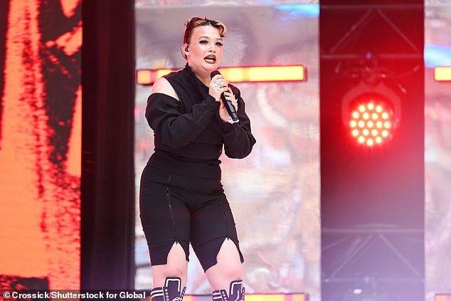 During her rendition of hit track Messy the 24-year-old said: 'Sorry guys my ears are going in and out.' before shouting out, 'Can I get some new ears?'
