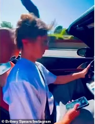 Worryingly, Jayden never let go of his iPhone while driving the silver sportscar and glanced down at the screen at least twice during her video despite California's hands-free driving laws