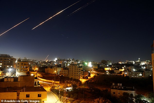 Iran's ongoing retaliatory attacks with missiles towards Israel are seen from Hebron, West Bank on June 15, 2025