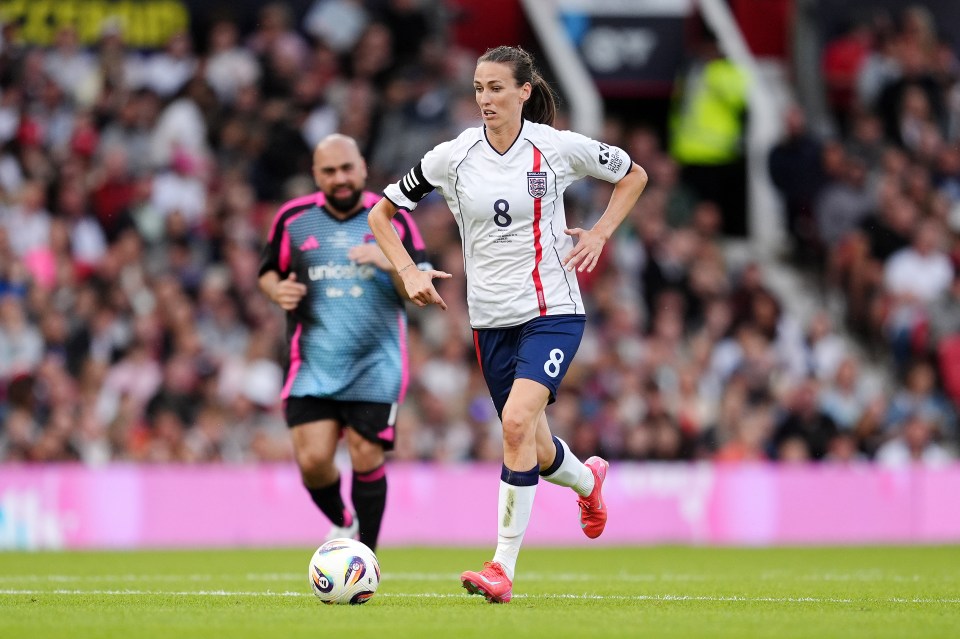 Jill Scott playing soccer for England.