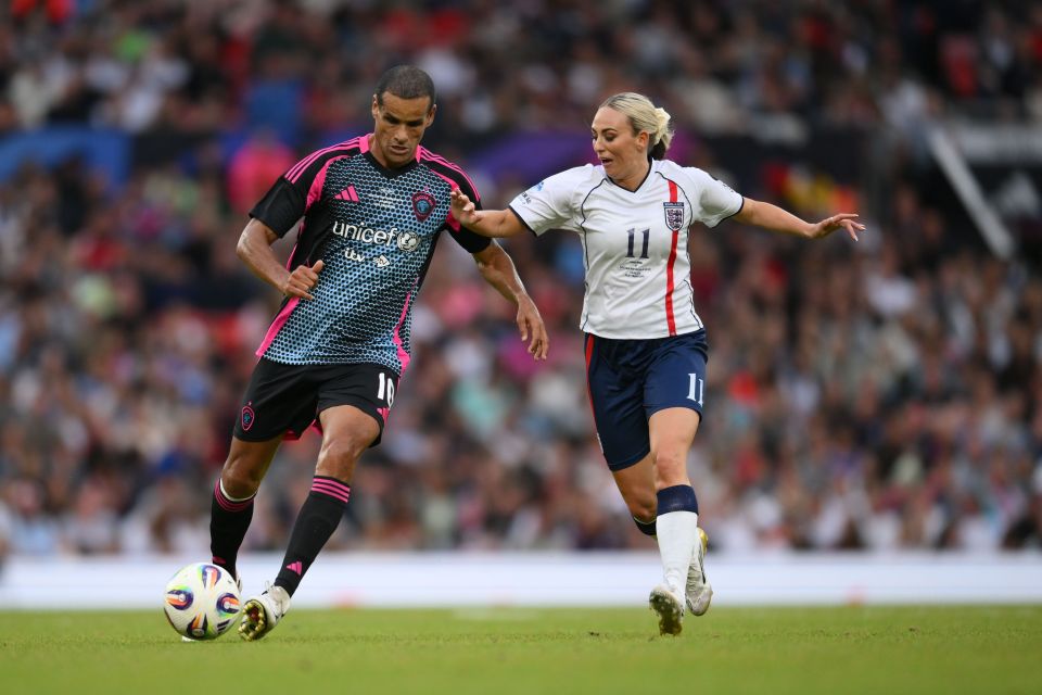 Rivaldo and Toni Duggan playing soccer at Soccer Aid for UNICEF.