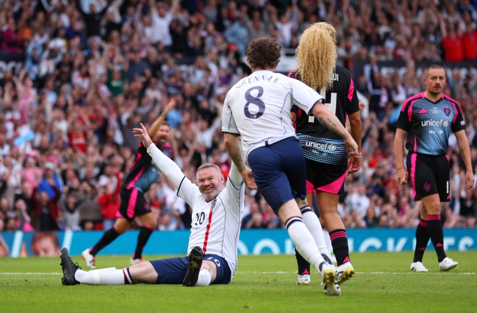 Wayne Rooney celebrating a goal at a Soccer Aid match.