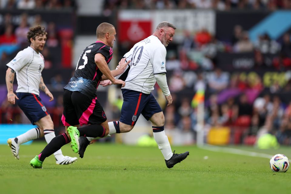 Wayne Rooney of England playing soccer.