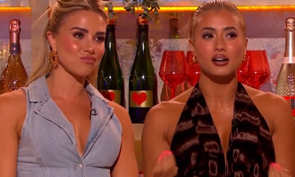Two women from Love Island sitting together.