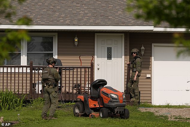 Authorities went house to house in rural Belle Plaine, Minnesota on Sunday as the search for Boelter continued