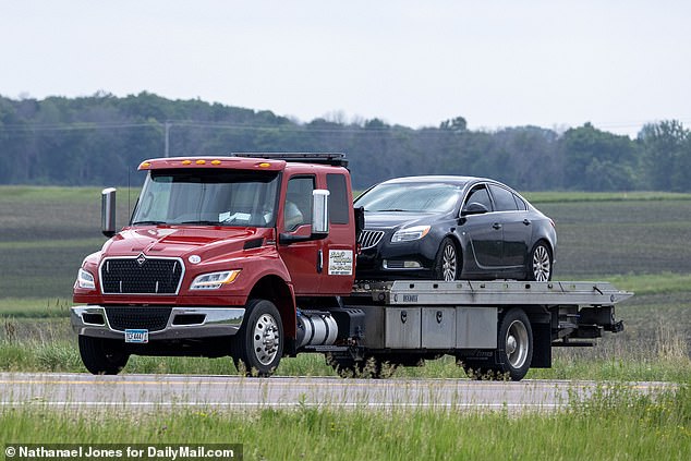 By around 4pm Sunday, a four-door dark blue Buick Regal sedan was removed from the search area on a flatbed truck