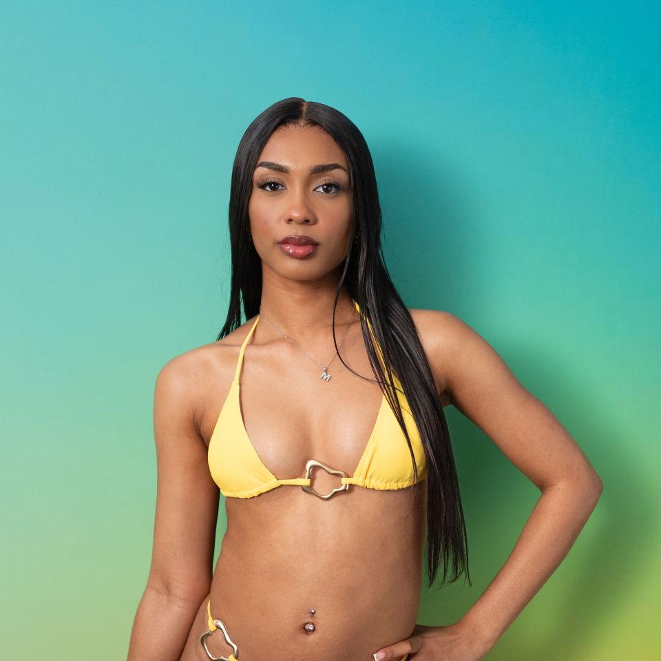 Malisha, a 24-year-old teaching assistant from Broxbourne, in a yellow bikini.