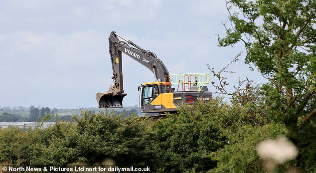 An excavator pictured at Aycliffe Quarry in County Durham, which locals have claimed stinks so bad it's ruining their lives and causing them to fall ill