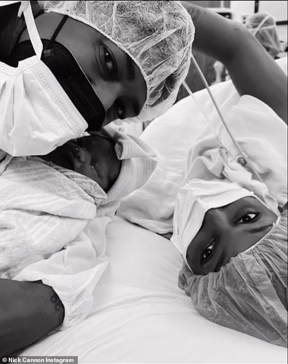 Adding to the brood: Nick Cannon made the surprise announcement that he had welcomed his ninth child with his tenth and 11th children still on the way as he shared this family snap featuring 40-year-old model and new mom Lanisha Cole