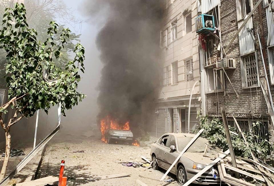 Burning cars after a bomb explosion in Tehran.