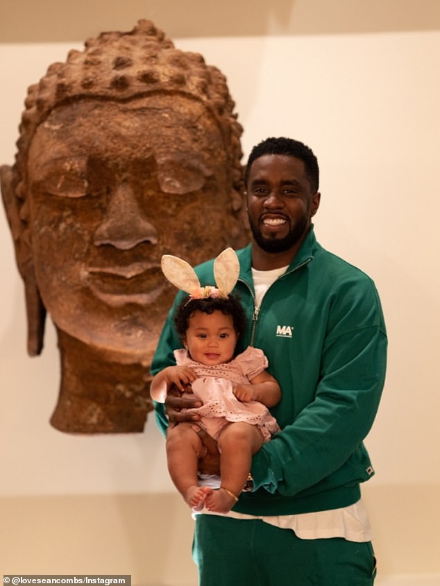 Love's account had a message that read 'Happy Dada Day! with a shot of her and the entertainer posed in front of an exhibit.