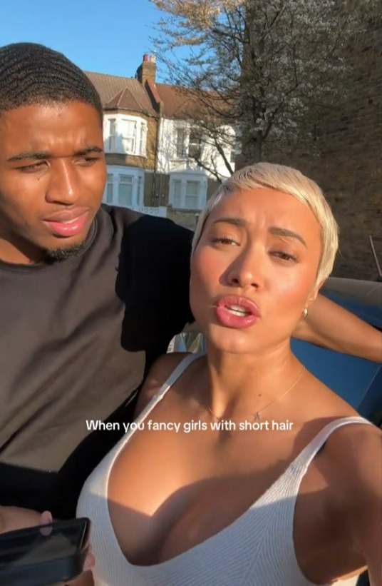Woman with short blonde hair and man with short dark hair.