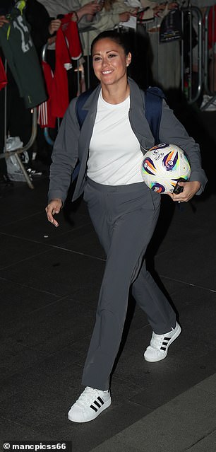 Sam Quek arrived with a football from the game