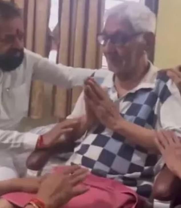 The father of Captain Sabharwal is pictured shortly after learning of the death of his son