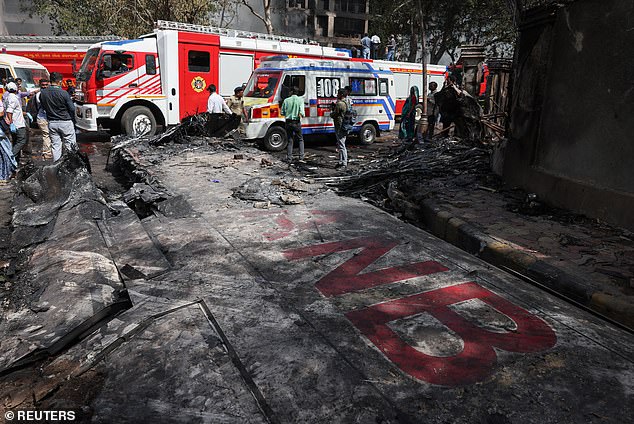 Wreckage of a Boeing 787 Dreamliner lies at the site, showing part of its registration "VT-ANB", where the Air India plane crashed in Ahmedabad, India, June 12, 2025