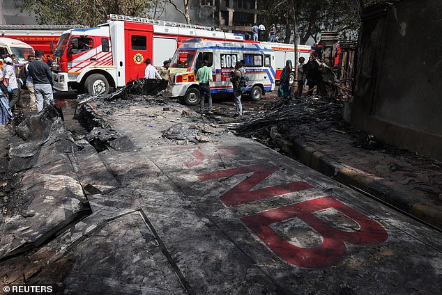 Wreckage of a Boeing 787 Dreamliner lies at the site, showing part of its registration "VT-ANB", where the Air India plane crashed in Ahmedabad, India, June 12, 2025