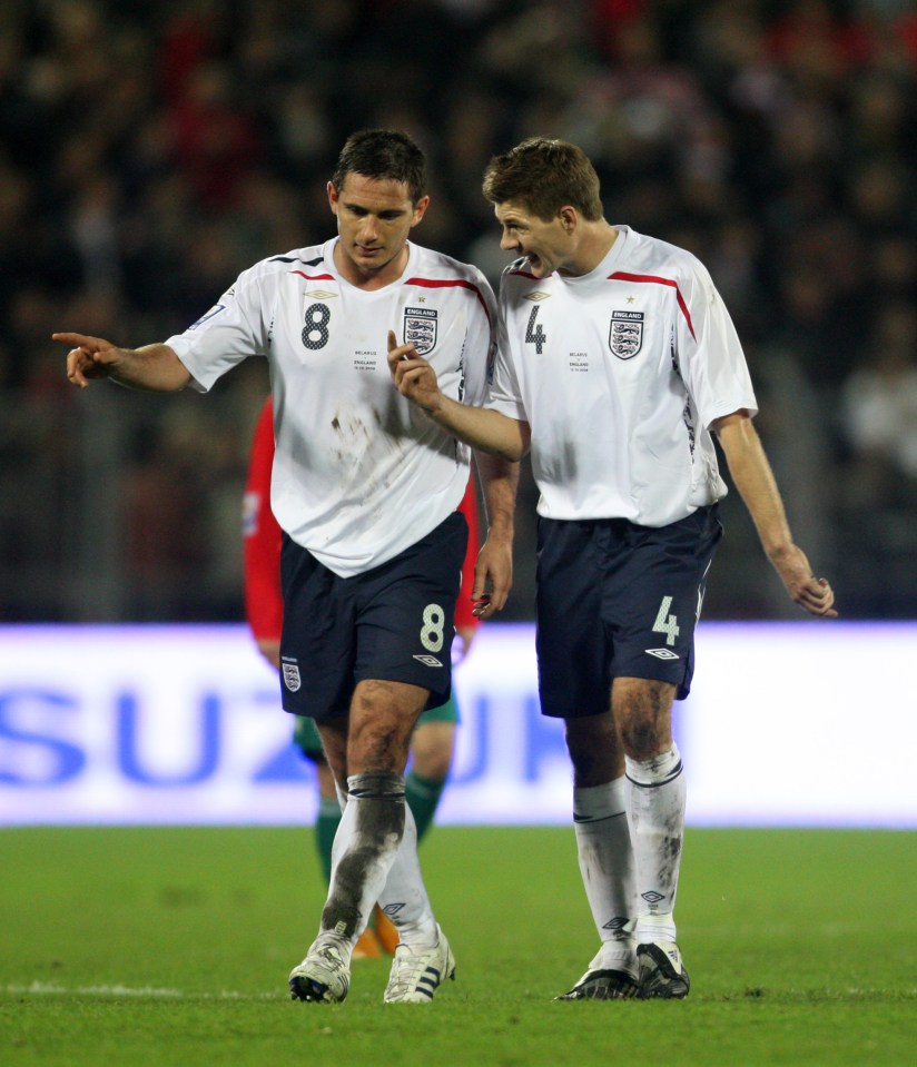 Frank Lampard and Steven Gerrard of the England national soccer team conversing at halftime.