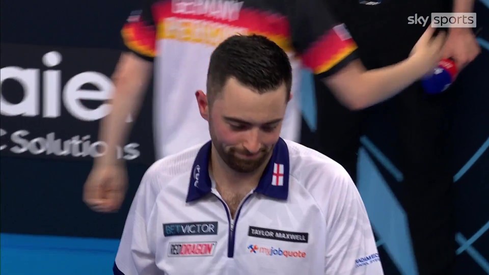 Luke Humphries looking dejected after a darts match.