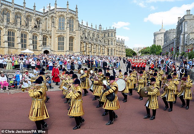 The Household Cavalry Band musicians make their way past the Lower Ward ahead of the annual Order of the Garter Service at St George's Chapel, Windsor Castle