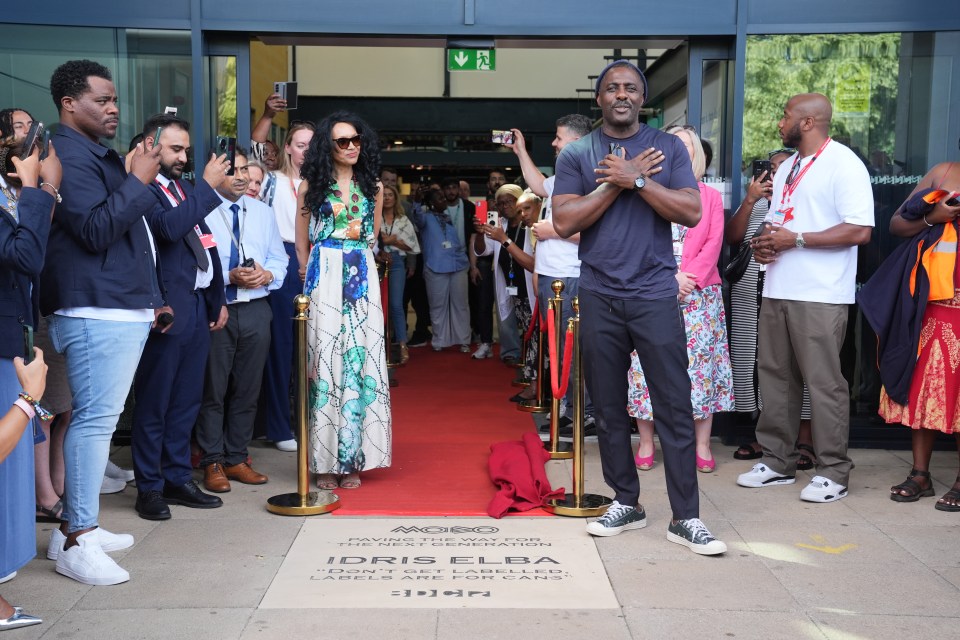 Idris Elba and Kanya King at a commemorative stone laying.