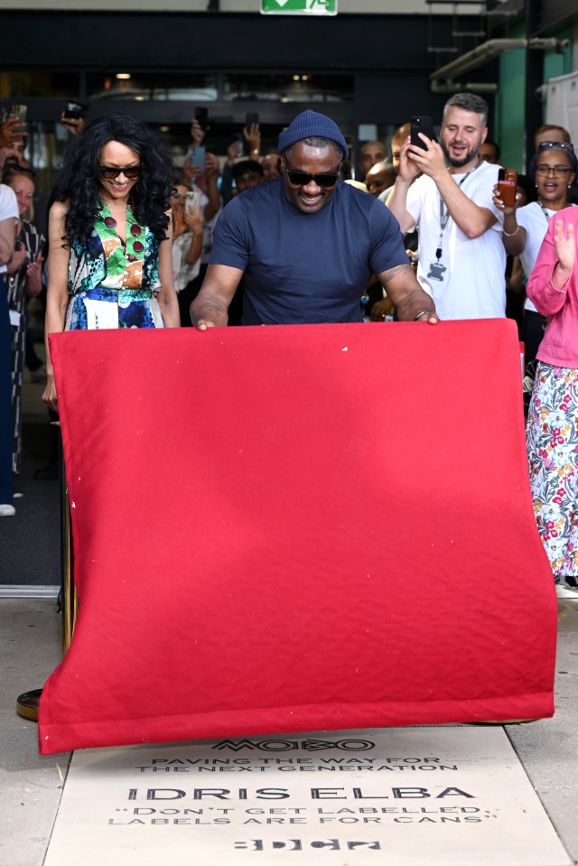 Kanya King CBE and Idris Elba unveiling a paving stone.