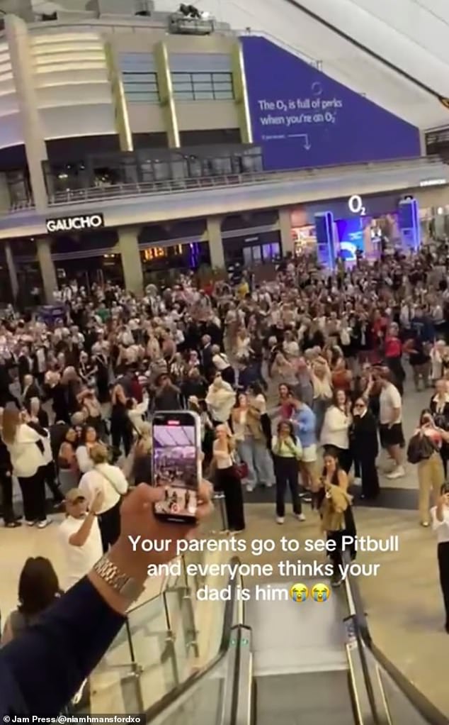 Phil, wearing a suit and aviator sunglasses, played along and waved his arm around which further added to the excitement
