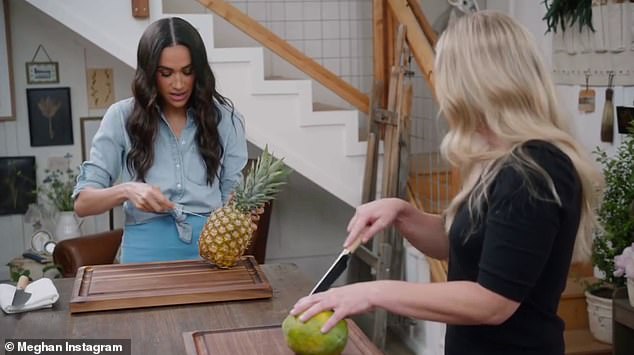 She then cut around the pattern on the outside of the pineapple, and used the skin to pull out a chunk of the fruit before taking a bite