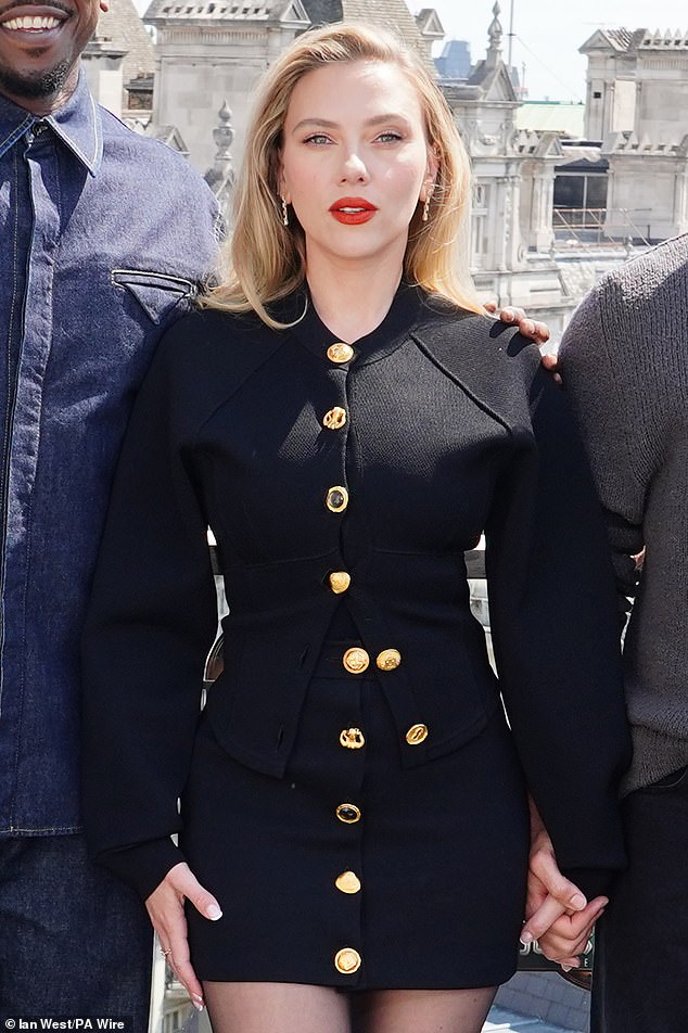 The Lucy actress - who recently resembled Marilyn Monroe on set of an upcoming 'gritty' Russian mafia movie - matched black high heels, finishing off with a bold red lipstick
