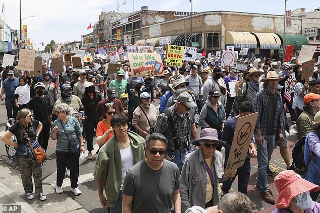 The sideshows on the weekend followed a day of anti-ICE protesting in Oakland (pictured) that strained the resources of the already-understaffed and overwhelmed Oakland Police Department