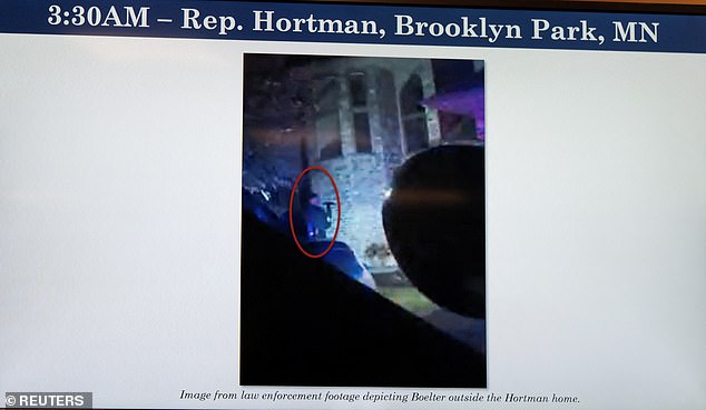 A screenshot from law enforcement footage showing Vance Boelter outside the Hortman home on the night of his shootout with police before he escaped the scene on foot