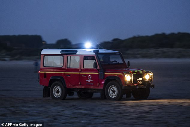 French firefighters patrol the beach of Gravelines in an attempt to stop smugglers