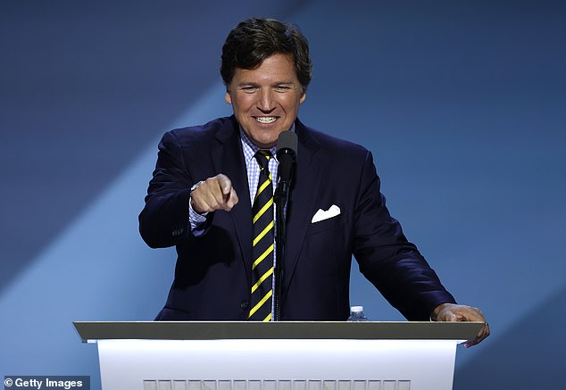 Tucker Carlson speaks on stage on the fourth day of the Republican National Convention