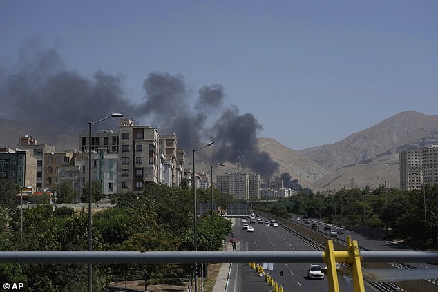 Smoke rises from an oil storage facility after it appeared to have been struck by an Israeli strike on Saturday, in Tehran, Iran, Monday, June 16, 2025