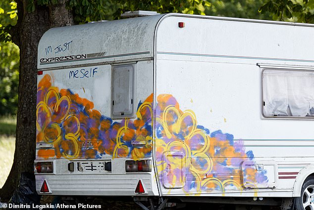 One of the vans on the encampment pictured with colourful art work pictured on Saturday