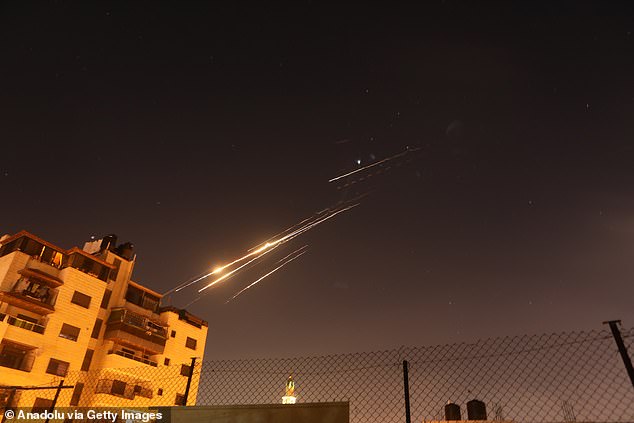 Iran's ongoing retaliatory attacks with ballistic missiles towards Israel are seen from Hebron, West Bank on June 16, 2025