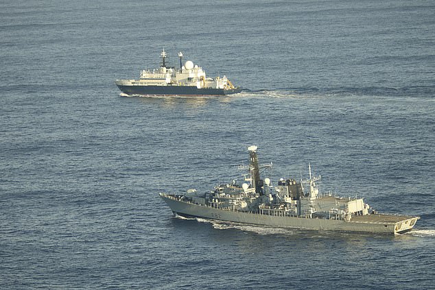 British frigate HMS Somerset (pictured front) flanks the Russian spy ship Yantar near UK water - which was feared to be hoovering up intelligence about the UK's underwater infrastructure