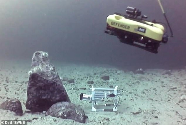 Video footage shows the device, which is adapted from a commercially available remotely operated vehicle (ROV), approaching and blasting a simulated target