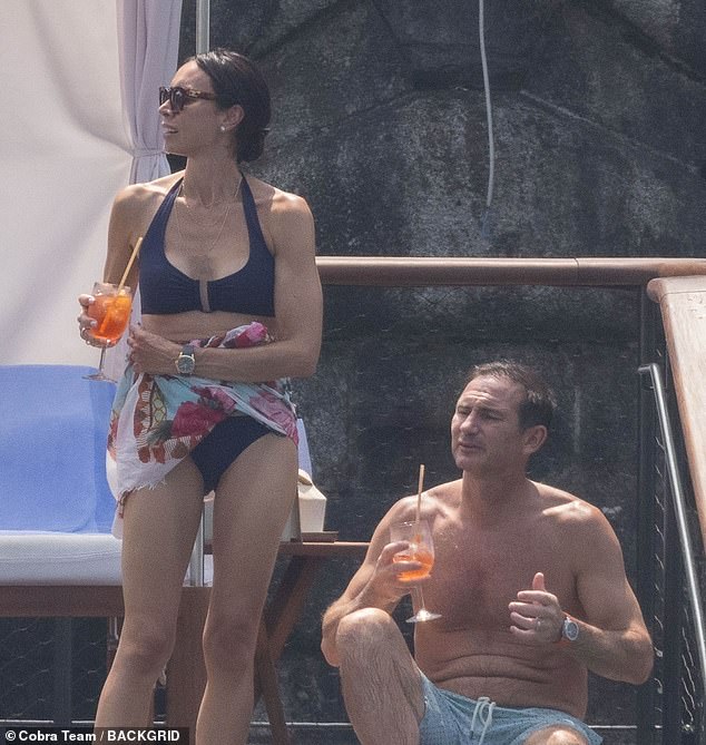 She paired it with a light blue and pink floral long sarong