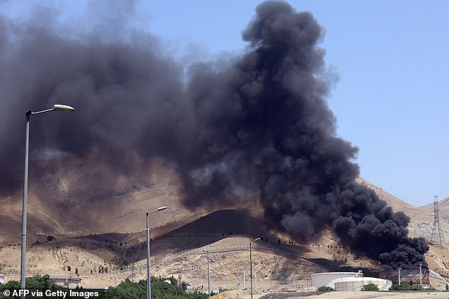 Smoke billows for the second day from the Shahran oil depot, northwest of Tehran