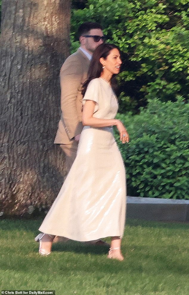 The pair were pictured enjoying a rehearsal dinner on Friday night (pictured)