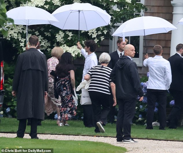 A glimpse of Anna Wintour's famous bob was caught following the bride and groom on Saturday. The bride credits Wintour for helping to pull together the ritzy day