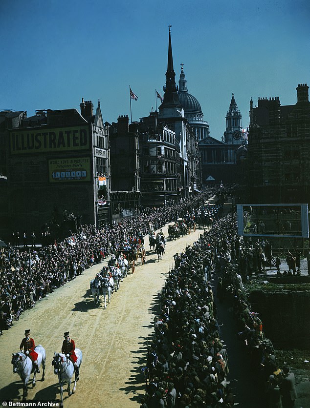 King George VI and Queen Elizabeth pass onlookers on the way back to the palace from St Paul's on their silver wedding anniversary