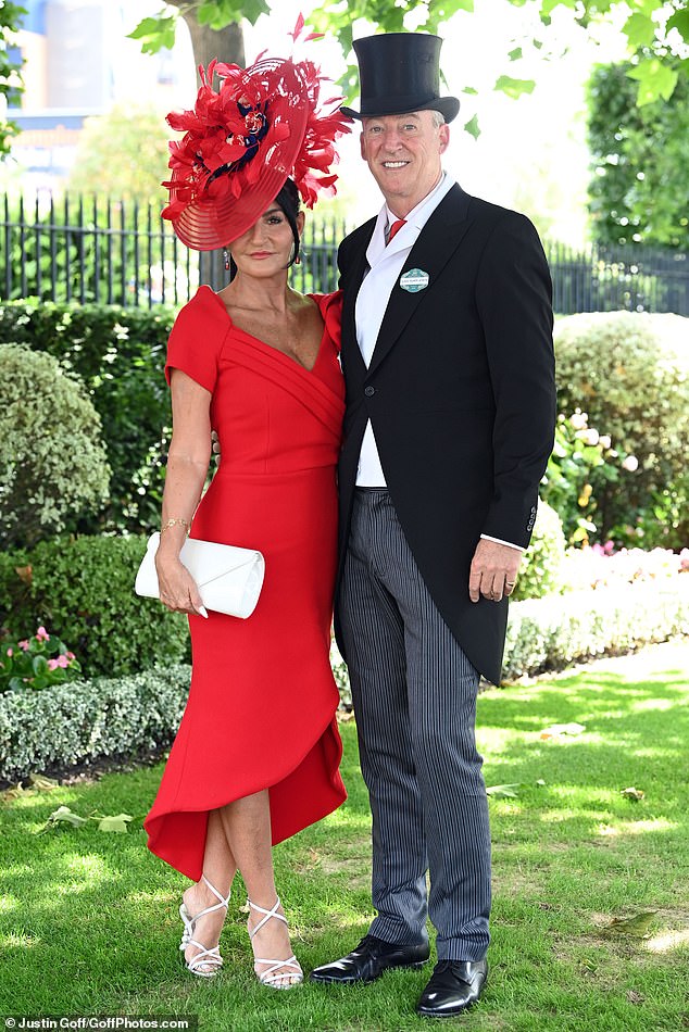 Couple goals: This elegant pair put on a sophisticated display in all their finery as they arrived at Ascot