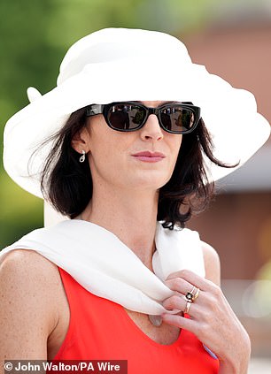 Keeping it simple: Some racegoers opted to pair their elegant ensembles with crisp white hats