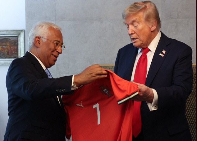 The US president was handed the shirt by the Portuguese president of the European Commission, Antonio Costa