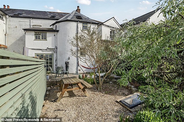 The property's garden enjoys a wide variety of shrubs and perennials with a seating area that looks out over Axminster and the surrounding countryside